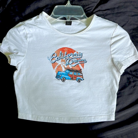 this top is from shein, it is a white shirt with blue, black, and tan-orange top - Picture 1 of 3